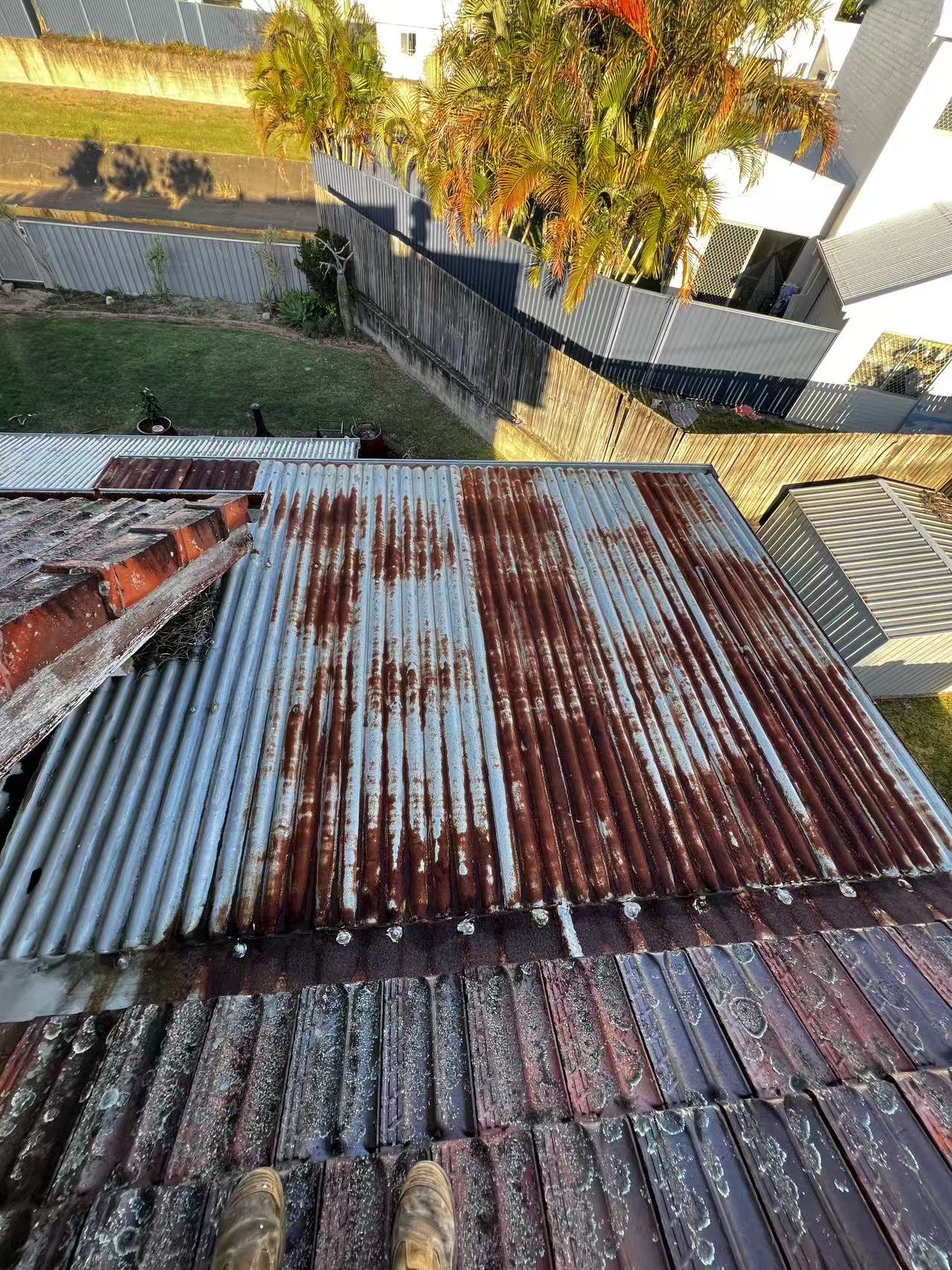 Overall view of corrosion across corrugated metal roof sheets